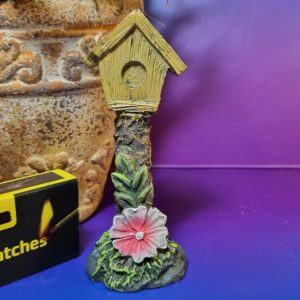 Birdhouse on Stump with Flower